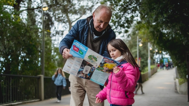 A grandfather and his granddaughter in Tibidabo